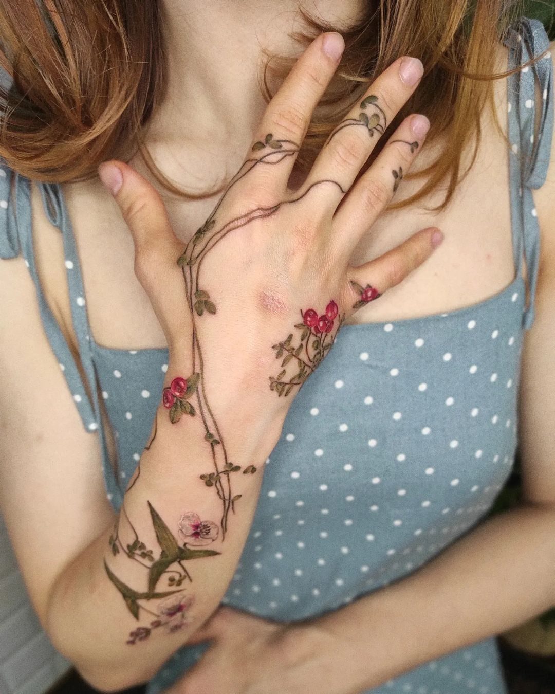 Full colour floral sleeve tattoo by Ink District Amsterdam